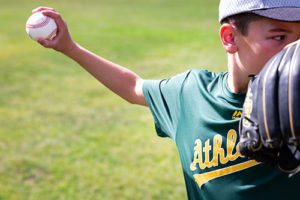 Boy pitching a baseball